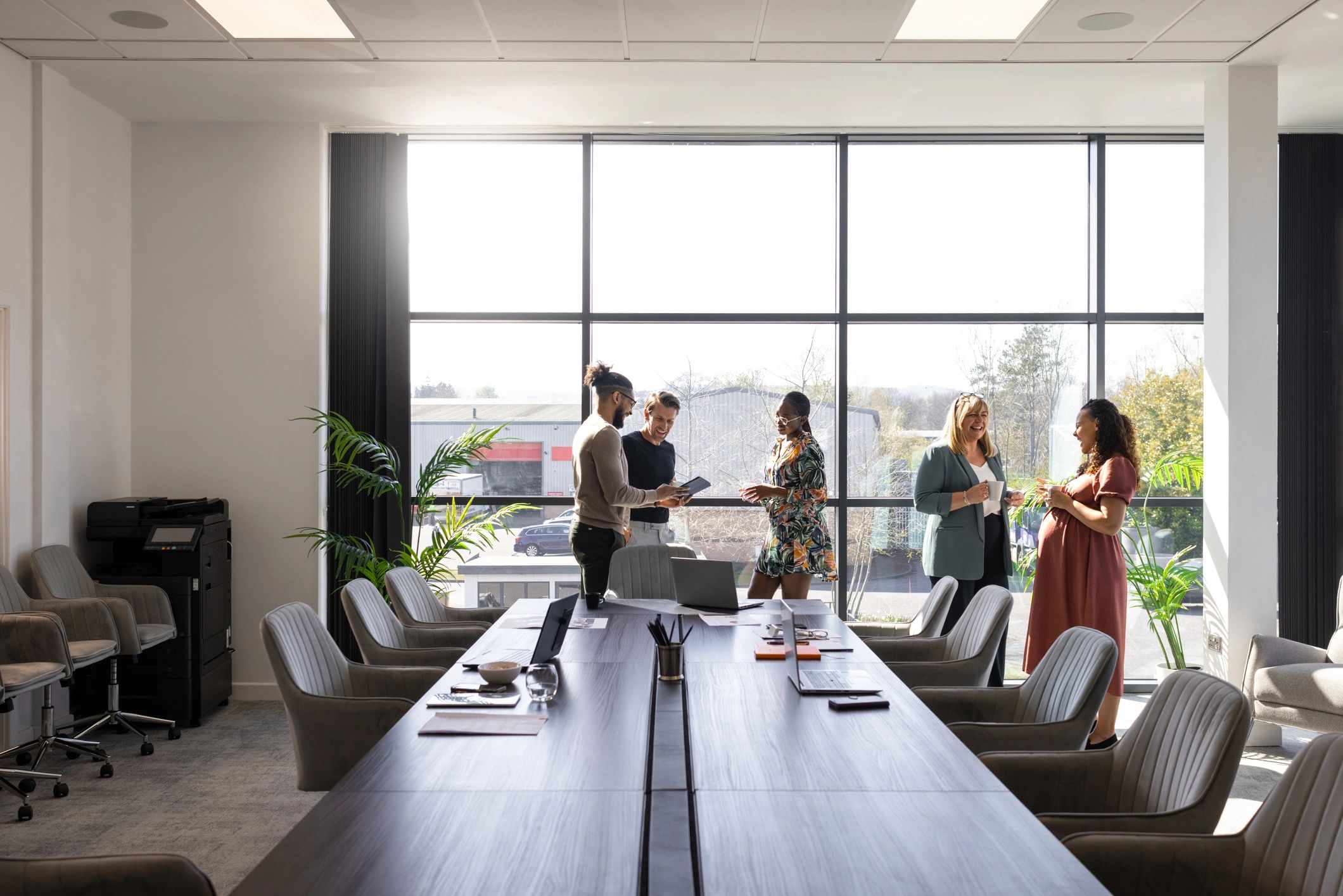 Business colleagues discussing work in a modern conference room